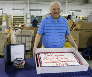 Jackson, MI, Register Clerk Daniel Kistka is honored for 50 years of federal service. 
