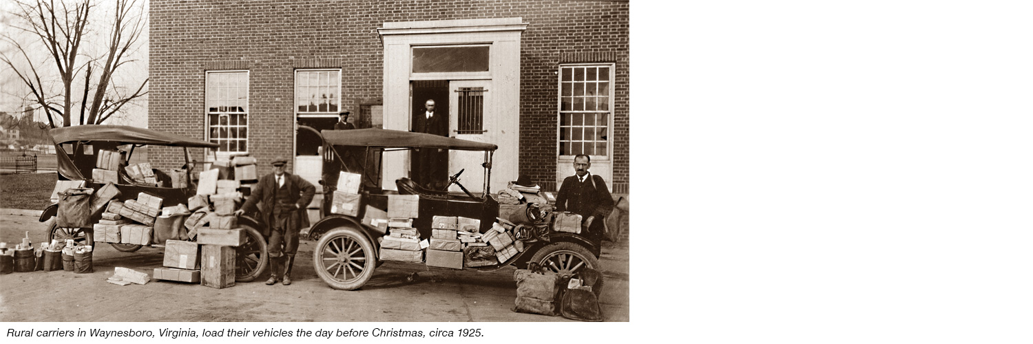 Rural carriers load their vehicles for Christmas deliveries, circa 1925