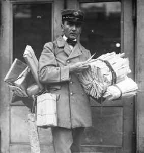 Carrier delivering mail.